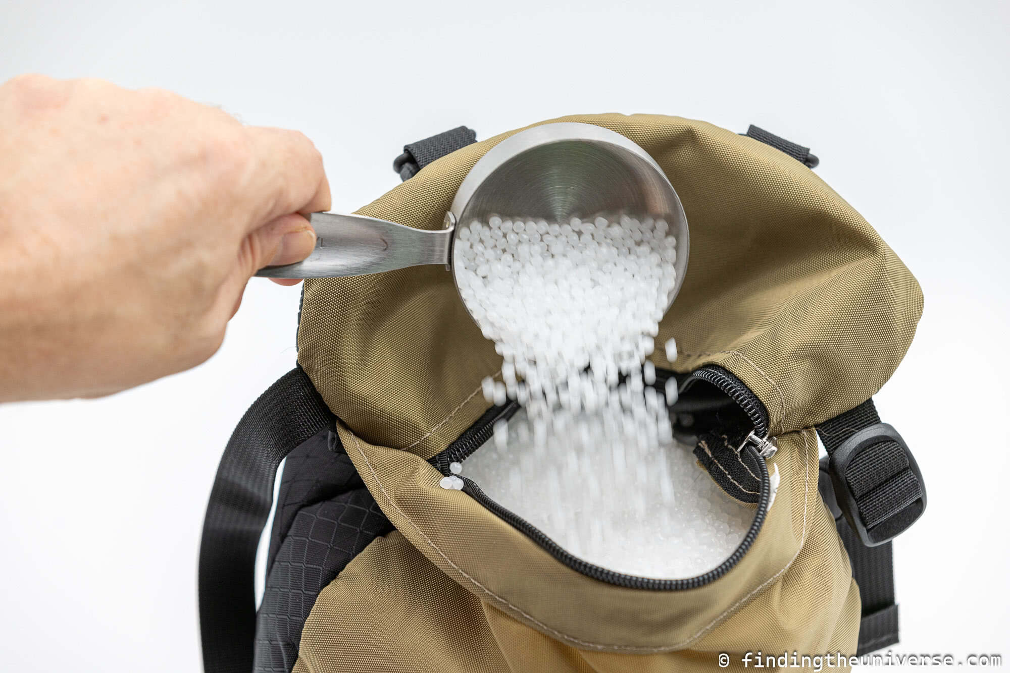 Filling a photography bean bag by Laurence Norah
